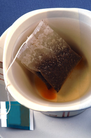 black tea in bags on the kitchen table.の写真素材