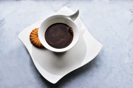 black coffee in a decorative white cupの写真素材