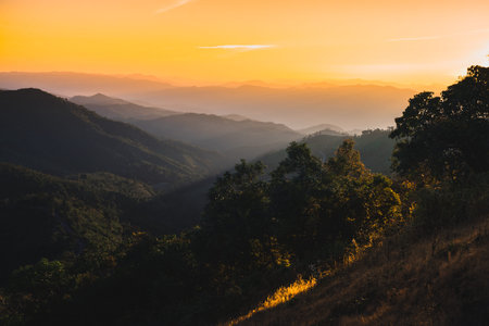 Colorful sunset over the mountains at Doi Pui Co, Mae Hong Son, Thailand.の写真素材