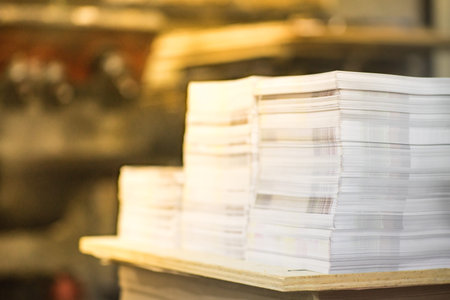 High Contrast, Stack of Printed Paper. Industry Offset Sheets in printing factory.