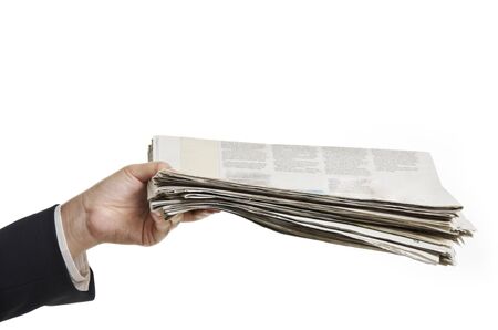 a female hand holding newspapers as giving toの写真素材