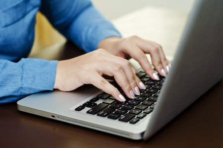 a female working on her laptop 