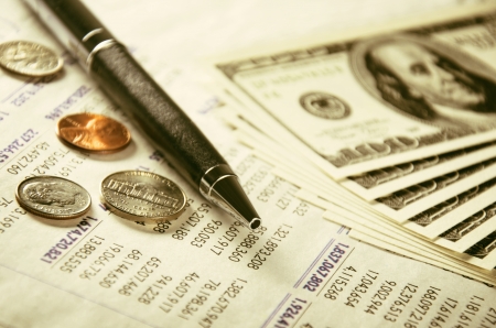 Numeral statement, pen and US currencyの写真素材