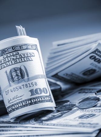 Closeup of roll up American billsの写真素材