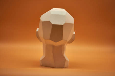 Plasterhead. Statue of a man on an orange background. Creative work of art. Plaster head. Statue of a man on an orange background. Creative work of art.の写真素材