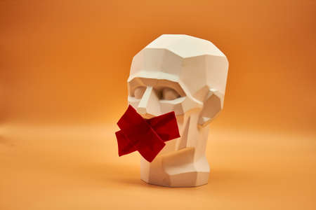 Plasterhead. Statue of a man on an orange background. Creative work of art. Plaster head. Statue of a man on an orange background. Creative work of art.の写真素材