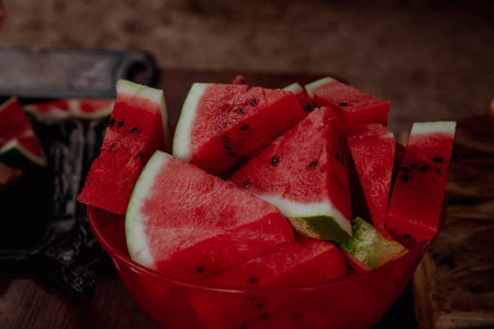 Triangular watermelon slices in a bowl on the table. high quality photoの写真素材