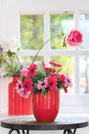 red vase flower on metal table in vintage roomの写真素材
