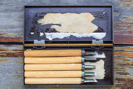 Carving hand tools or chisels on wooden backgroundの写真素材