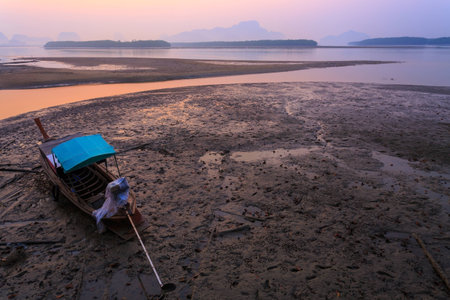 Thai long tail boat in sunrise at Samchong Tai bay, Phang nga, Thailand