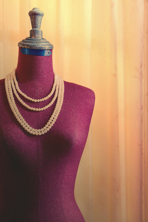 Old clothing mannequin with curtain backgroundの写真素材