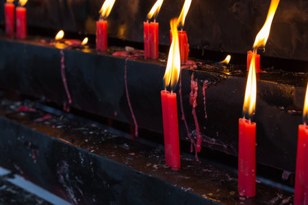 Burning red candle in Chinese temple, Chinaの写真素材