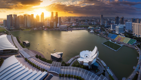 Cityscape panorama of Singapore city skyline at sunset in Marina Bayのeditorial素材