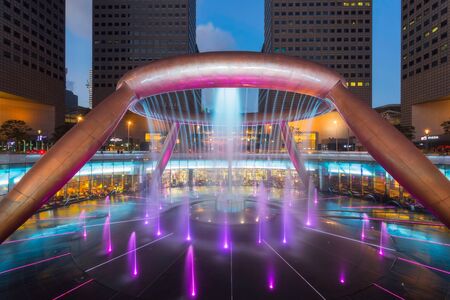 SINGAPORE - FEB 26, 2016: Fountain of Wealth with Suntec Towers at dusk in Singapore.のeditorial素材