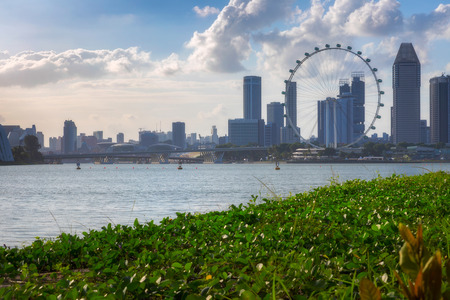 Cityscape of Singapore city skyline with ferris wheel in Marina Bayのeditorial素材