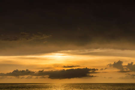 Sunset sky and sea with nimbus cloud backgroundの写真素材