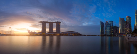SINGAPORE - FEB 24, 2016: Cityscape panorama of Singapore city skyline with Marina Bay Sands hotel and ferris wheel at sunrise in Marina Bayのeditorial素材