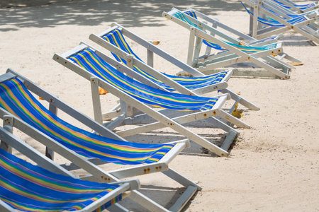Beach chairs on white sand beach