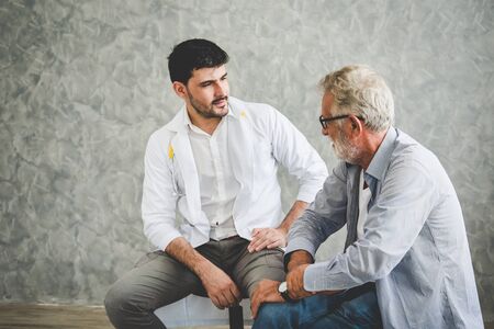 Professional psychologist doctor discussing with patient in therapy sessions at hospital room, Medical and Behavioral Health conceptの写真素材