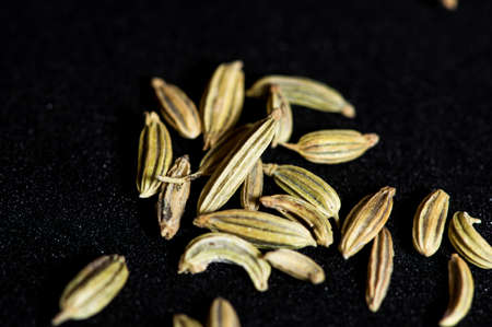 Macro of fennel seeds on a black backgroundの写真素材