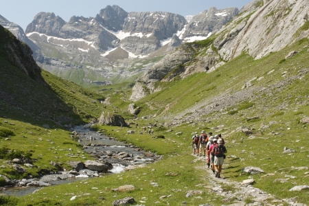 hikers on footpath in valley in French Pyreneesの写真素材