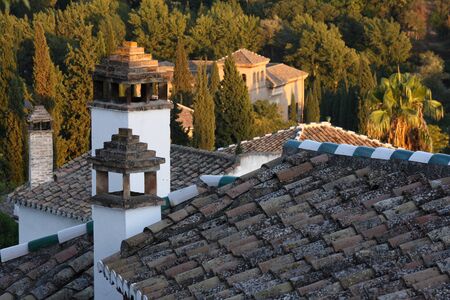 roofs and chimneys of houses in Albayzin, Granadaの写真素材