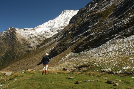 walker admiring view in French Alpsの写真素材