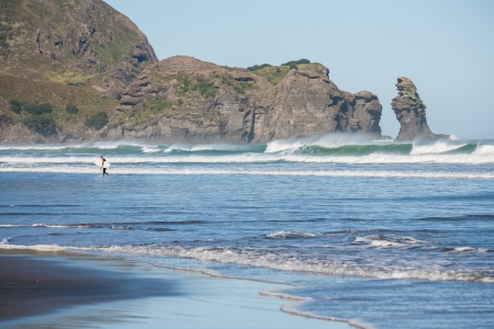 surfer at Piha beachの写真素材