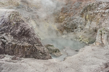 steam raising from collapsed crater in Waiotapuの写真素材