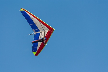 rogallo wing on blue skyの写真素材