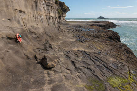lifebuoy on cliffs at Muriwaiの写真素材