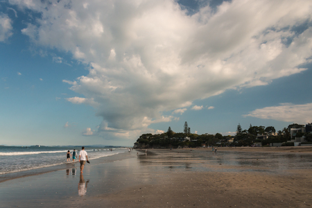 people walking on Takapuna Beachの写真素材