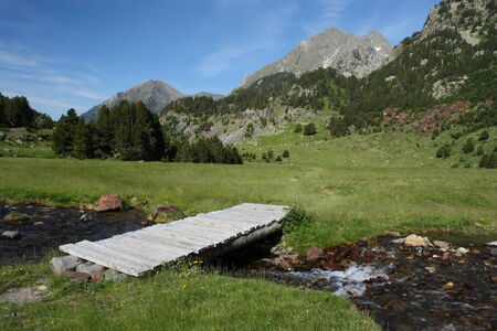 wooden bridge over river Esera in Posets-Maladetaの写真素材