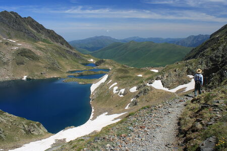 walker at Boms du Port lakesの写真素材