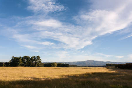 cirrus clouds above rural countrysideの写真素材