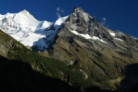 snow covered mountain peaks in Swiss Alpsの写真素材