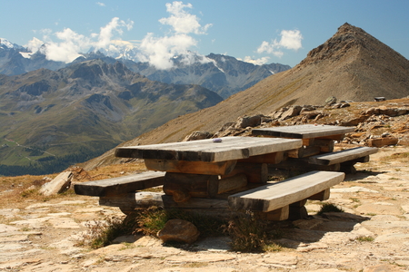 wooden table and benches in Swiss Alpsの写真素材