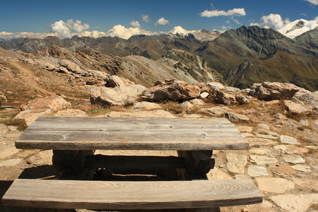 wooden bench in Swiss Alpsの写真素材