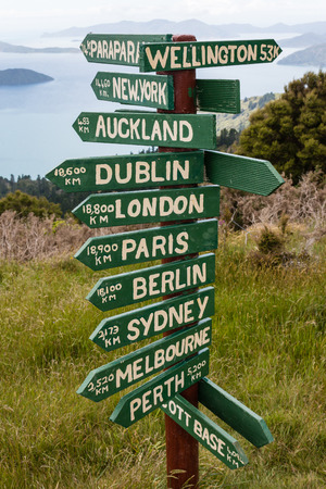wooden pole with distances on Queen Charlotte Trackの写真素材