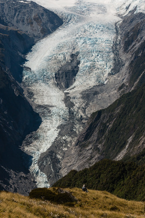 walker admiring Franz Josef Glacierの写真素材