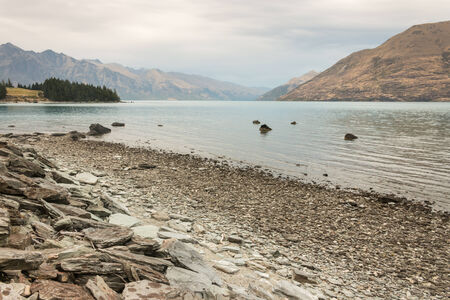 morning mist ove lake Wakatipu in New Zealandの写真素材