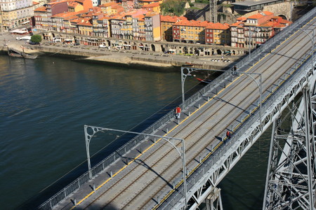 Ribeira with arch Ponte Luis I in foreground, Portoの写真素材