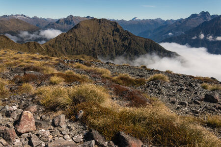 mountain peaks above inversion in Fiordland National Parkの写真素材