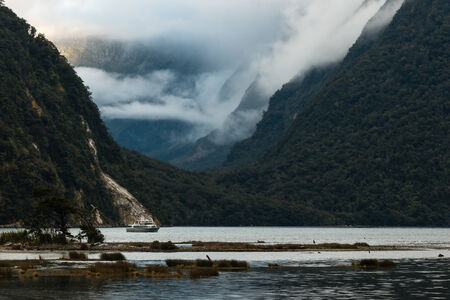 cruise ship in Milford Sound in Fiordlandの写真素材