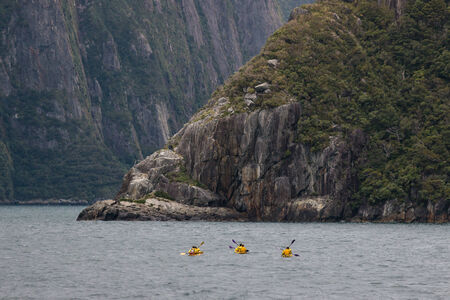 sea kayaking in Milford Sound, New Zealandの写真素材