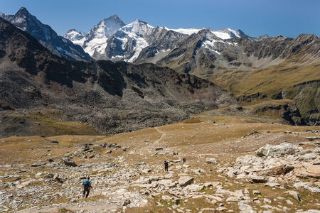 hikers descending in Val d Anniviers in Swiss Alpsの写真素材
