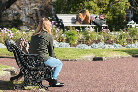 young couple resting in park の写真素材