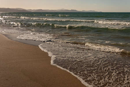 crashing waves on beach in Coromandel Peninsulaの写真素材