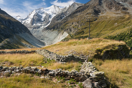 wooden cross above valley in Val d Anniviers, Switzerlandの写真素材