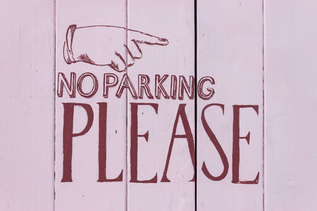no parking sign painted on fenceの写真素材
